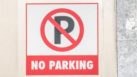no parking sign on wall
