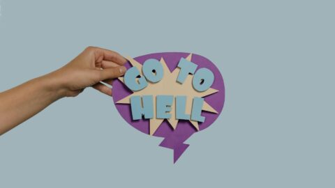 a person holding an artistic paper cutout